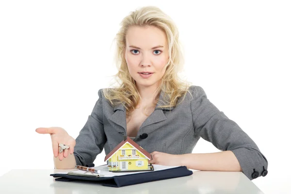 Business girl with a toy house and a folder — Stock Photo, Image