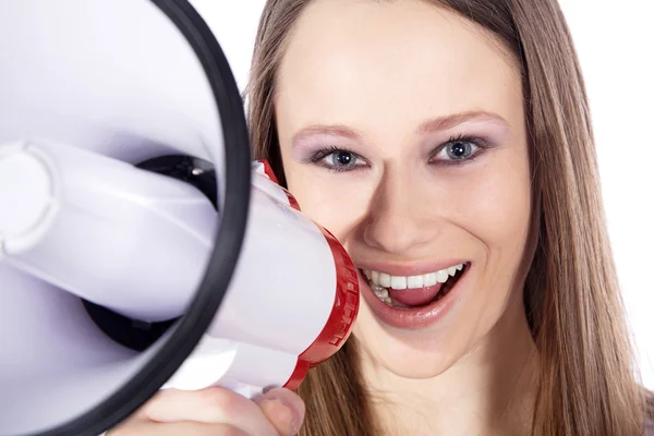 Blonde girl shouts in a megaphone — Stock Photo, Image