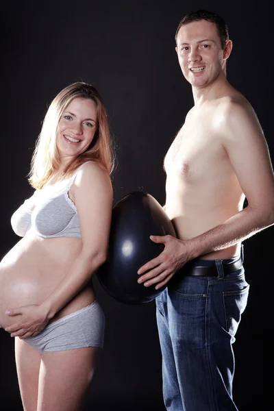 Pregnant girl with her boyfriend Stock Photo