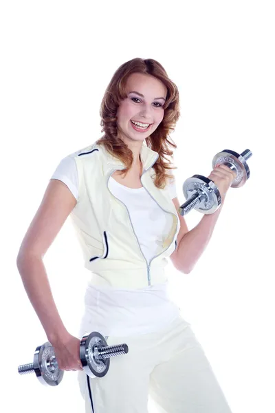 Portrait of a young pretty woman holding weights and doing fitness — Stock Photo, Image