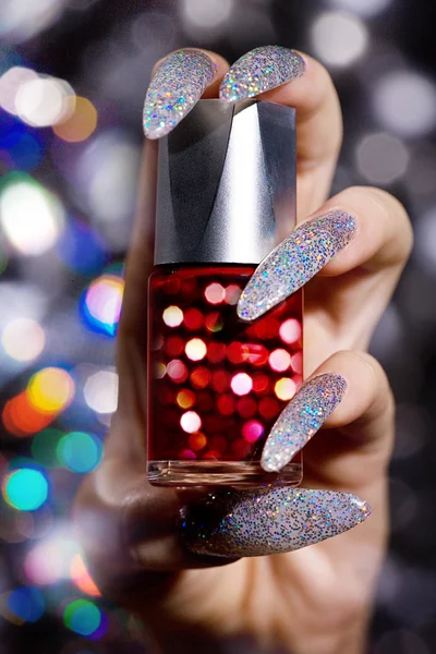 Nail polish in hand — Stock Photo, Image