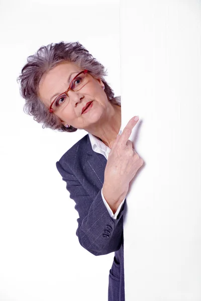 Senior woman with a cardboard — Stock Photo, Image