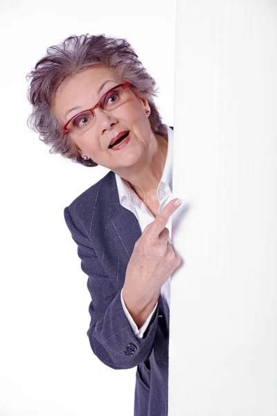 Senior woman with a cardboard — Stock Photo, Image