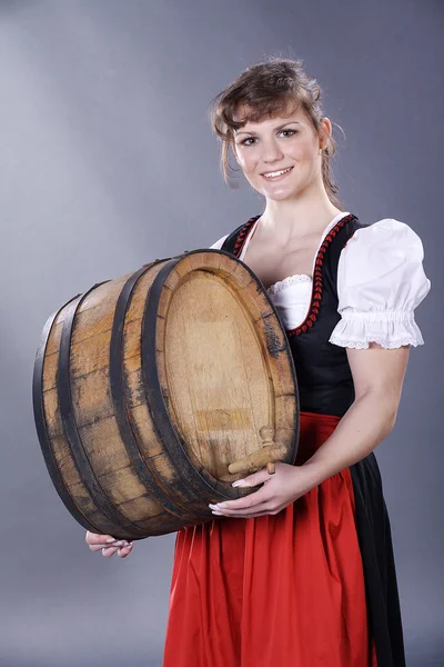 Girl with a barrel of wine — Stock Photo, Image