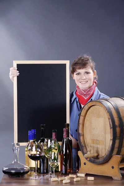 Woman with wine and a board — Stock Photo, Image