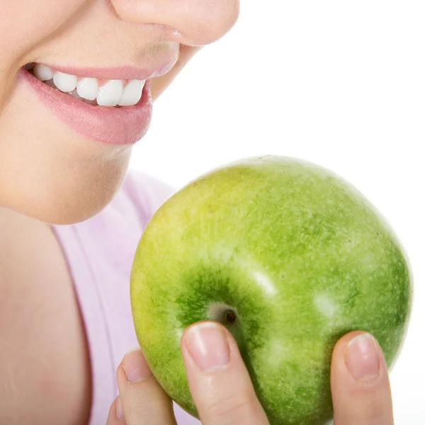 Blond woman eat green apple — Stock Photo, Image