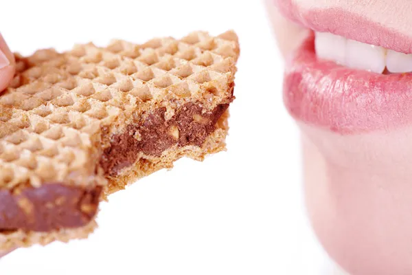 Mujer comiendo productos horneados —  Fotos de Stock