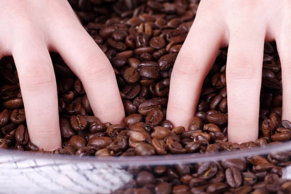 Girl with coffee beans — Stock Photo, Image