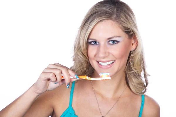 Closeup portrait of beautiful young woman brushing her teeth — Stock Photo, Image