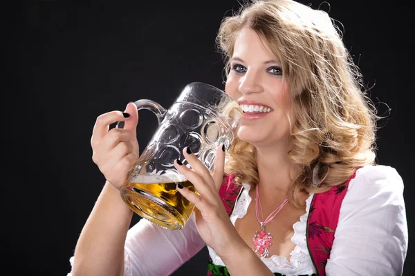 Young sexy woman wearing a dirndl with beer mug — Stock Photo, Image