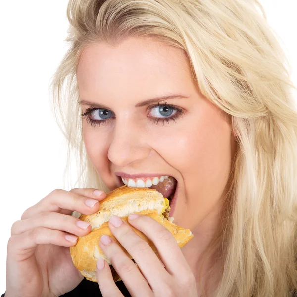 Blondes Mädchen isst Brot — Stockfoto