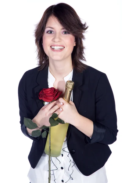 Brünettes Mädchen mit einer Flasche Champagner und einer Rose — Stockfoto