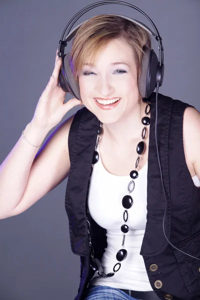 Young woman with headphones — Stock Photo, Image