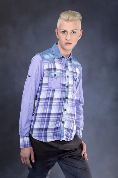 Fashion young man posing at studio — Stock Photo, Image