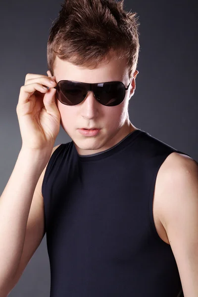 Fashion young man posing at studio — Stock Photo, Image