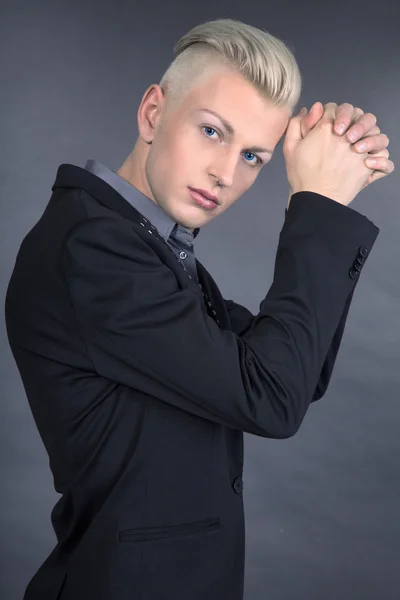 Fashion young man posing at studio — Stock Photo, Image