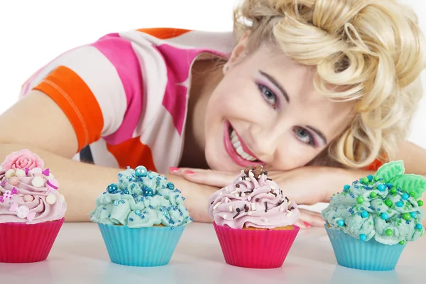 Young smiling woman with cupcake — Stockfoto