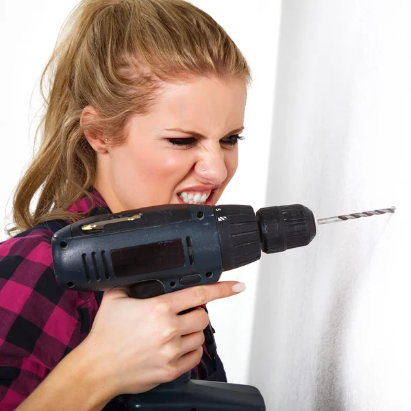 Young woman with drill — Stock Photo, Image