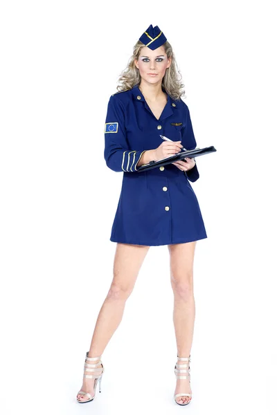 Pretty blonde stewardess in sexy pose — Stock Photo, Image