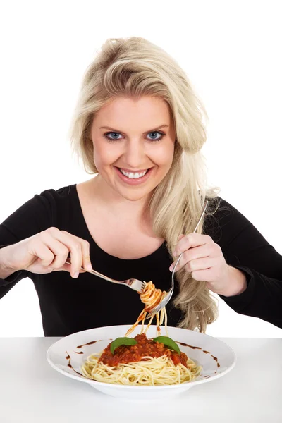 Blonde girl eating spaghetti Stock Image