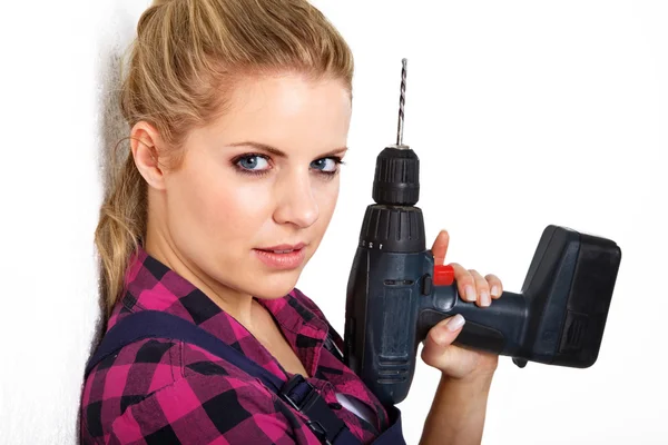 Young woman with drill Royalty Free Stock Photos