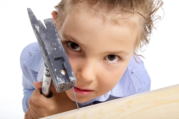 Young girl with hammer and nail — Stock Photo, Image