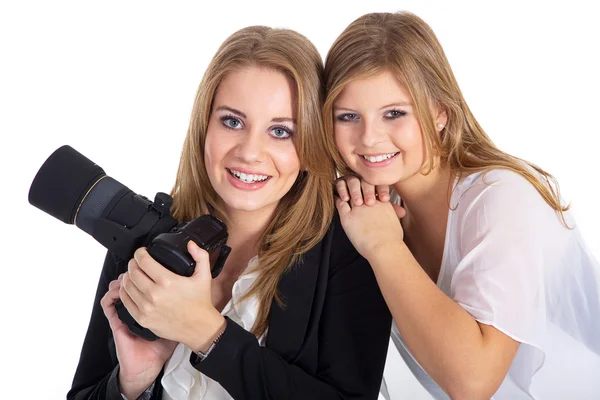 Two girls with a camera — Stock Photo, Image