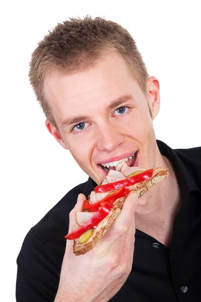 Mann isst ein Sandwich — Stockfoto