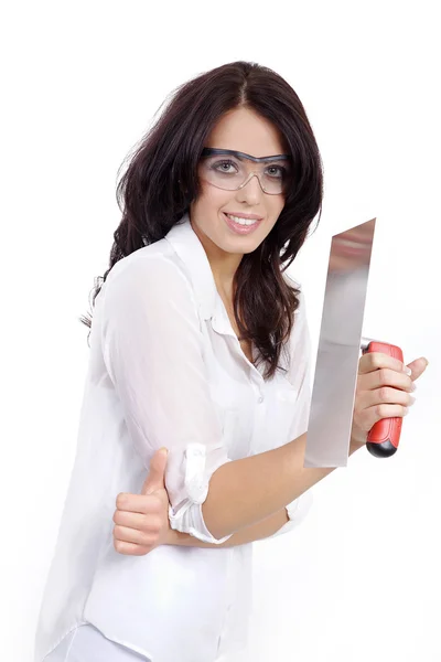 Brunette girl with a trowel — Stock Photo, Image