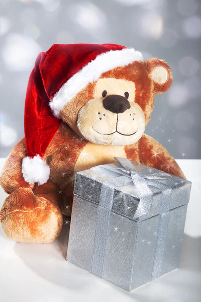 Santa oso con caja de regalo y ramo de luces —  Fotos de Stock