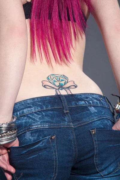 Girl with a tattoo on his back — Stock Photo, Image
