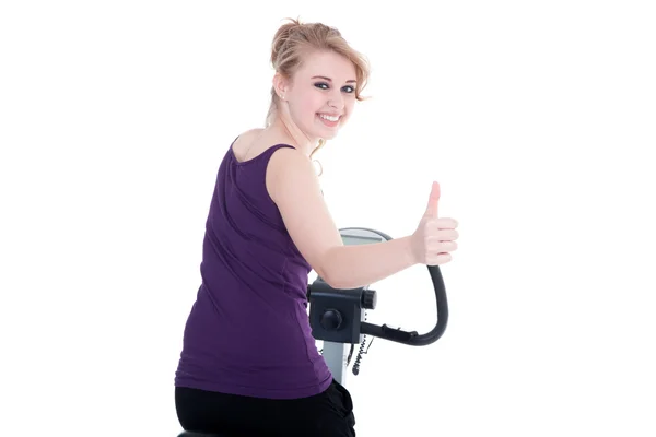 Young woman cycling smiles, thumb up — Stock Photo, Image