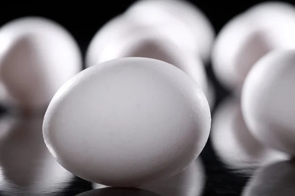 Raw white egg in the light-shadow play — Stock Photo, Image