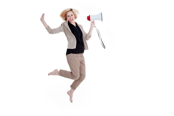 Businesswomen jumping with megaphone — Stock Photo, Image