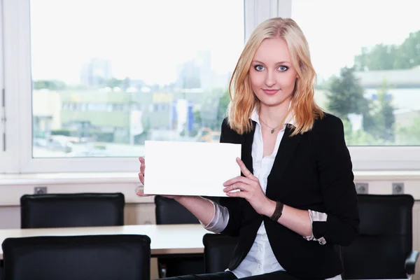 Businesswoman with white card — Stock Photo, Image