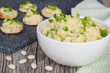 Pate from whire beans with green onions clipart