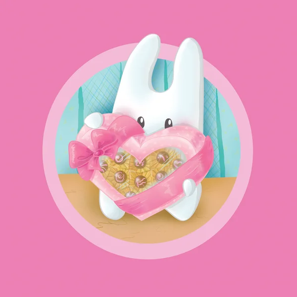 Bunny with a box of chocolates in a heart shape — Stock Photo, Image