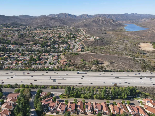 Aerial view of highway with traffic surrounded by houses, Interstate 15 with in vehicle movement. — Stock Photo, Image