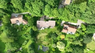 Aerial view of luxury villas with garden surrounded by forest, in the country side area of Walloon Brabant, Belgium