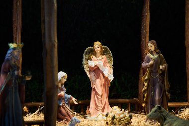 Sharm El Sheikh, Egypt - November 20, 2021: Night festive Christmas nativity scene represented with statuettes of Mary, Joseph and baby Jesus Christ