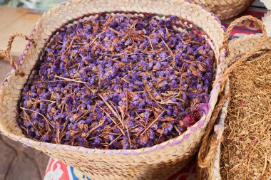 Dry forget me not flowers, healthy herbal tea in wicker basket. Herbal medicine. Traditional Egypt tea