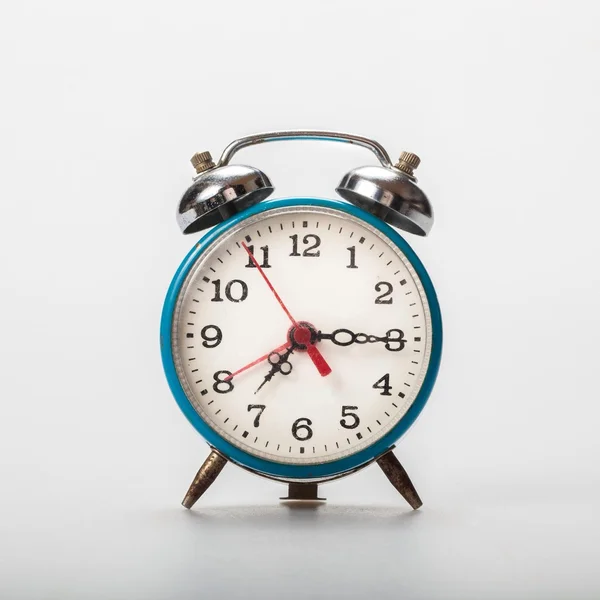 Old rusty clock on isolated white background, alarm, wake, wake up, ring, time — Stock Photo, Image