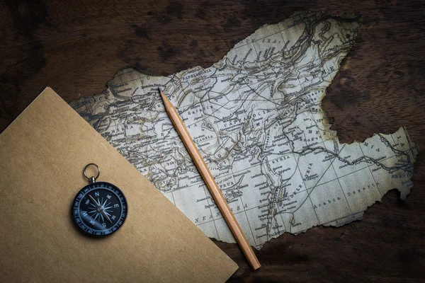 Old compass and vintage map