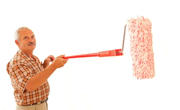 Senior man renovating home — Stock Photo, Image