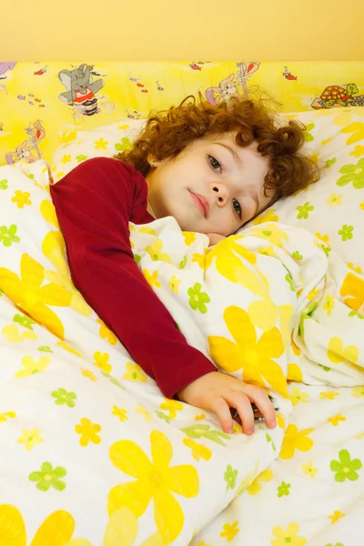 Beautiful little girl in bed — Stock Photo, Image