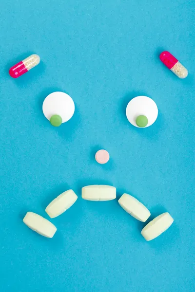 Sad smileyface made of pills — Stock Photo, Image