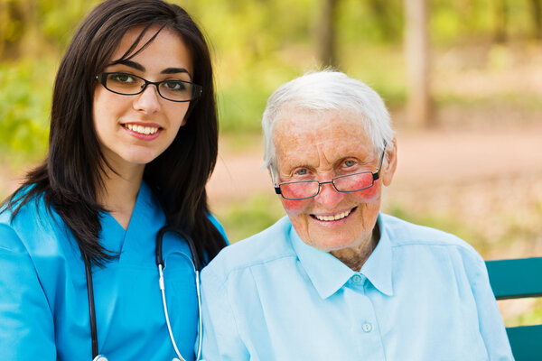 Portrait of Nurse and Elderly Patient