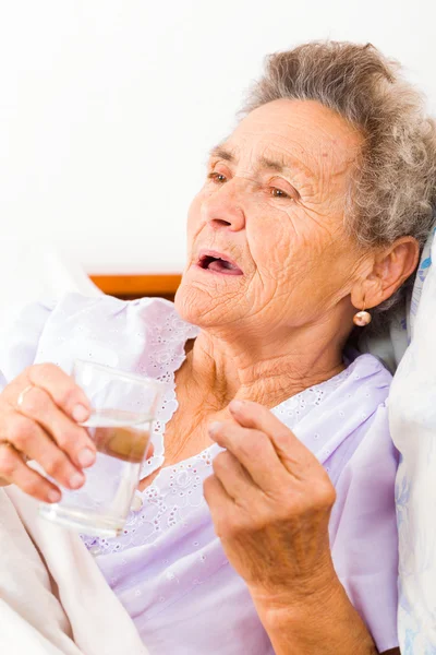 Medication given to elderly lady — Stock Photo, Image