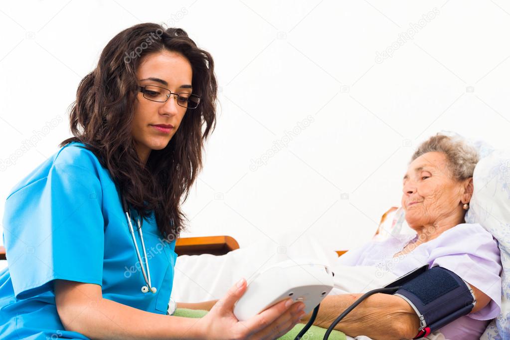 Nurse caring about senior patient