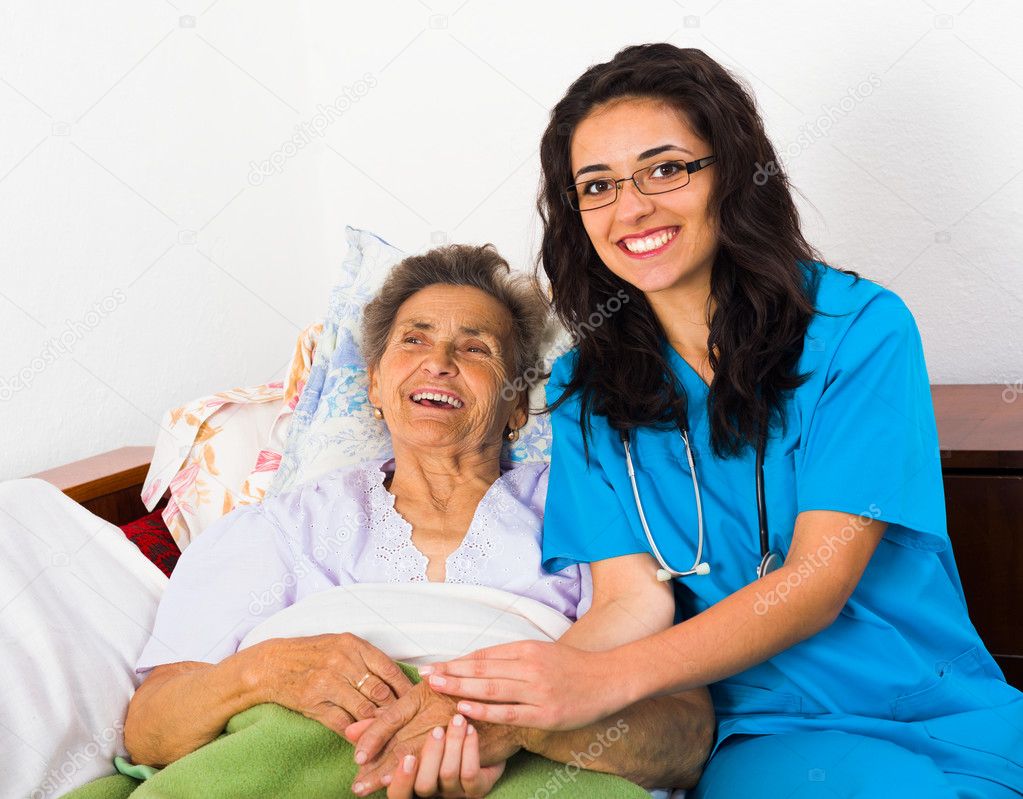 Caring nurse with patient